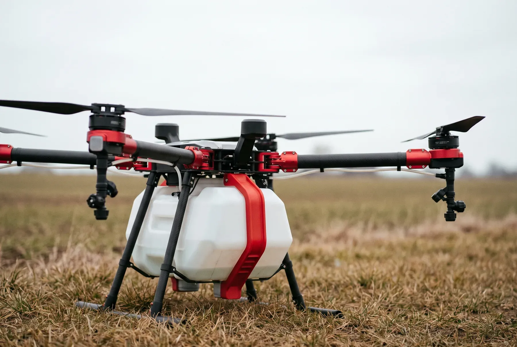 An XAG P-series agricultural drone standing at a field edge